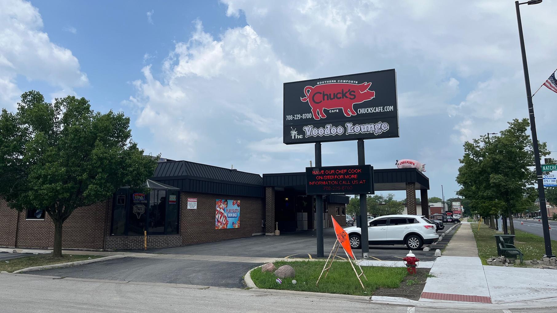 The parking lot-surrounded, banquet hall-esque Chuck’s Southern Comforts Cafe isn’t the straightforward bar and barbecue joint with slot machines that it appears to be from the outside. Credit: Daniel Hautzinger for WTTW The sign and exterior of Chuck's Southern Comforts restaurant