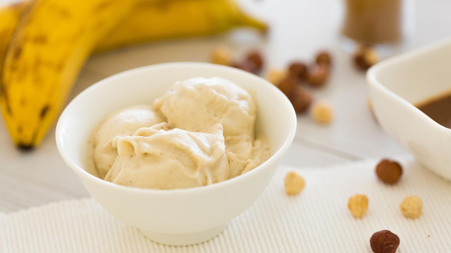 Credit: iStock Banana ice cream in a bowl in front of bananas