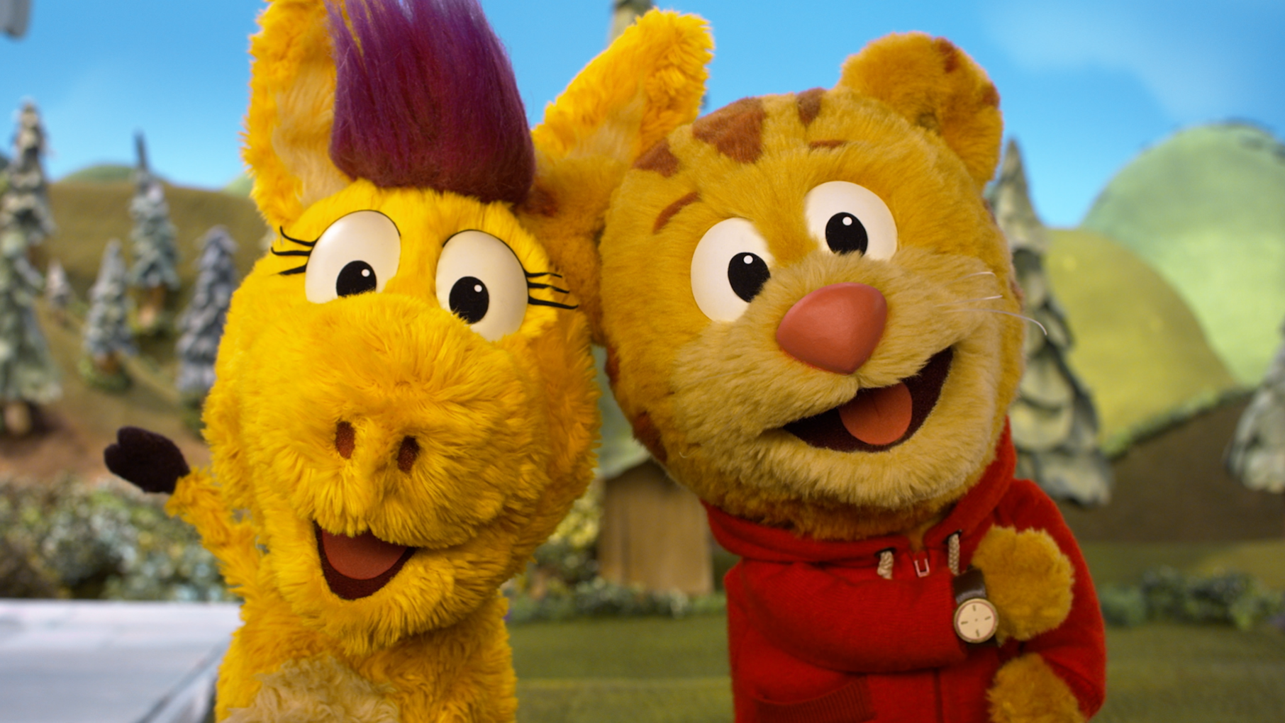 Donkey Hodie and Daniel Tiger puppets