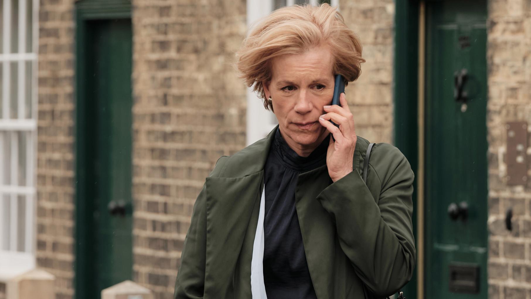 Doctor Goldberg on the phone outside
