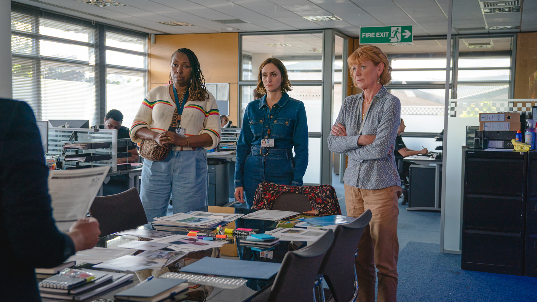 Becks, Suzie and Judith stand in an office