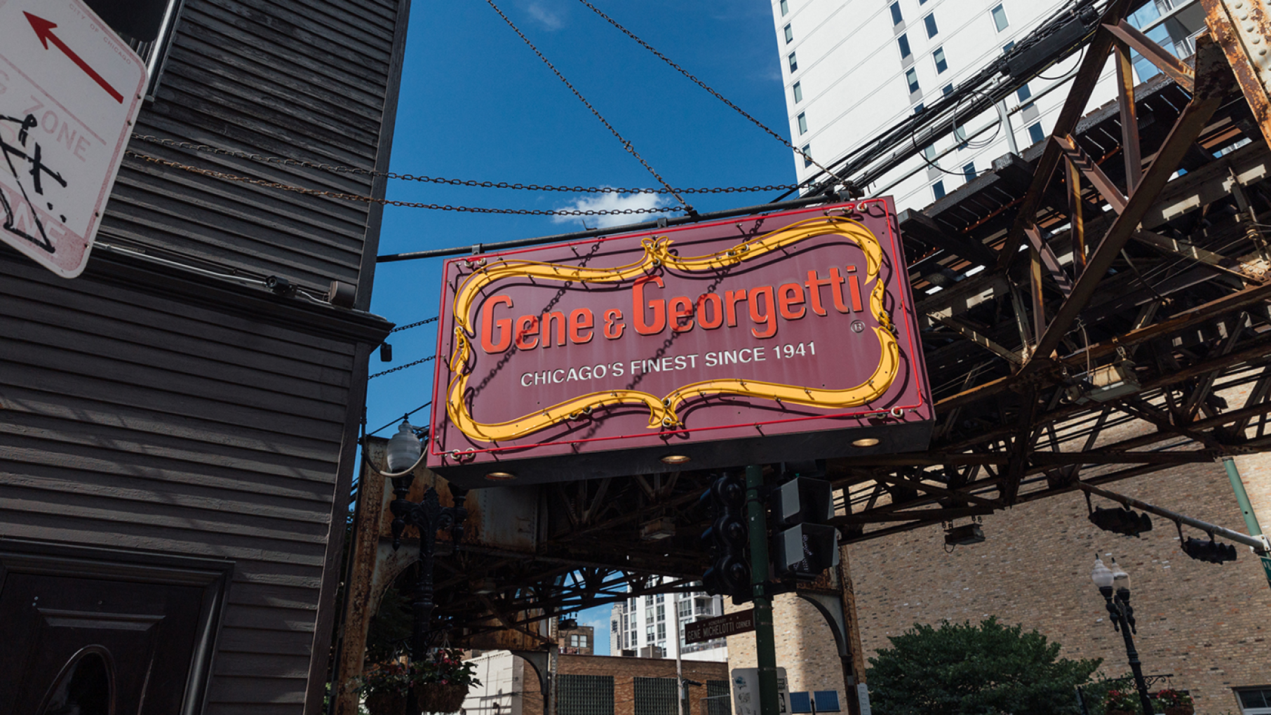 The Gene & Georgetti sign outside the restaurant in front of El tracks