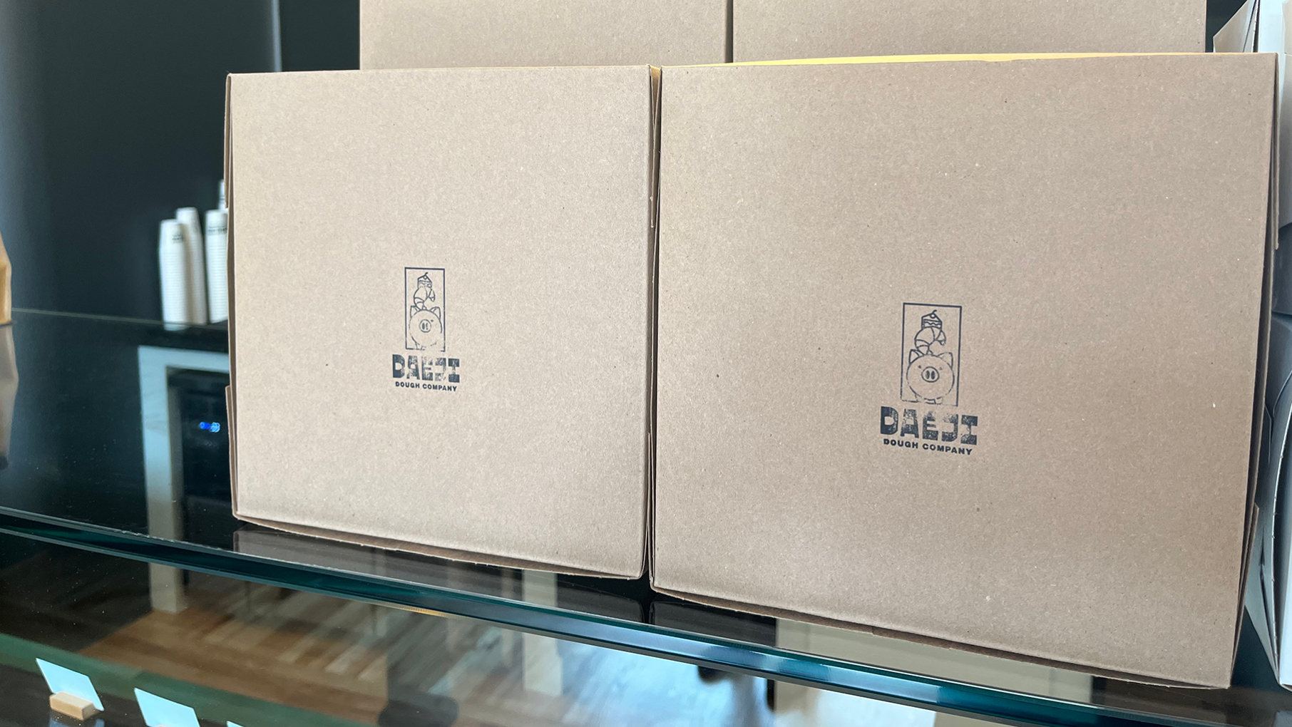 Boxes with Daeji Dough Co stamps on them