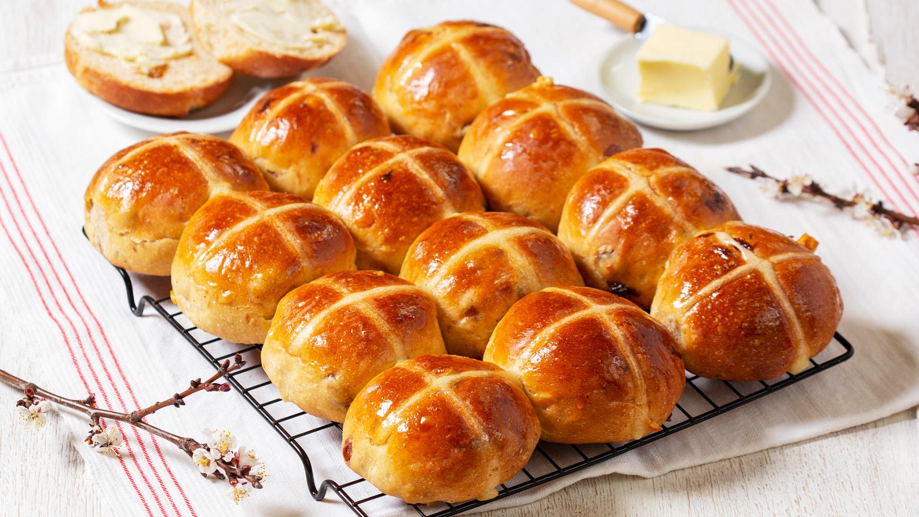 Hot cross buns on a cooling rack