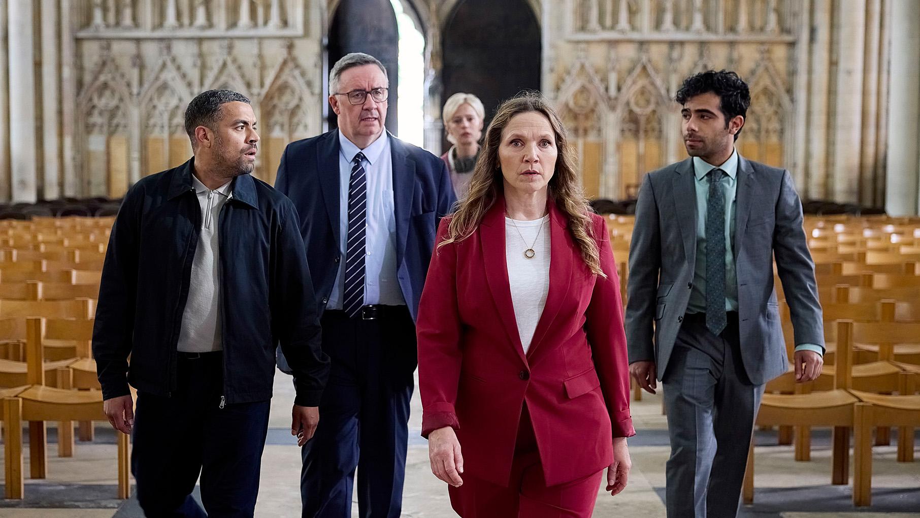 The team walks through York Minster