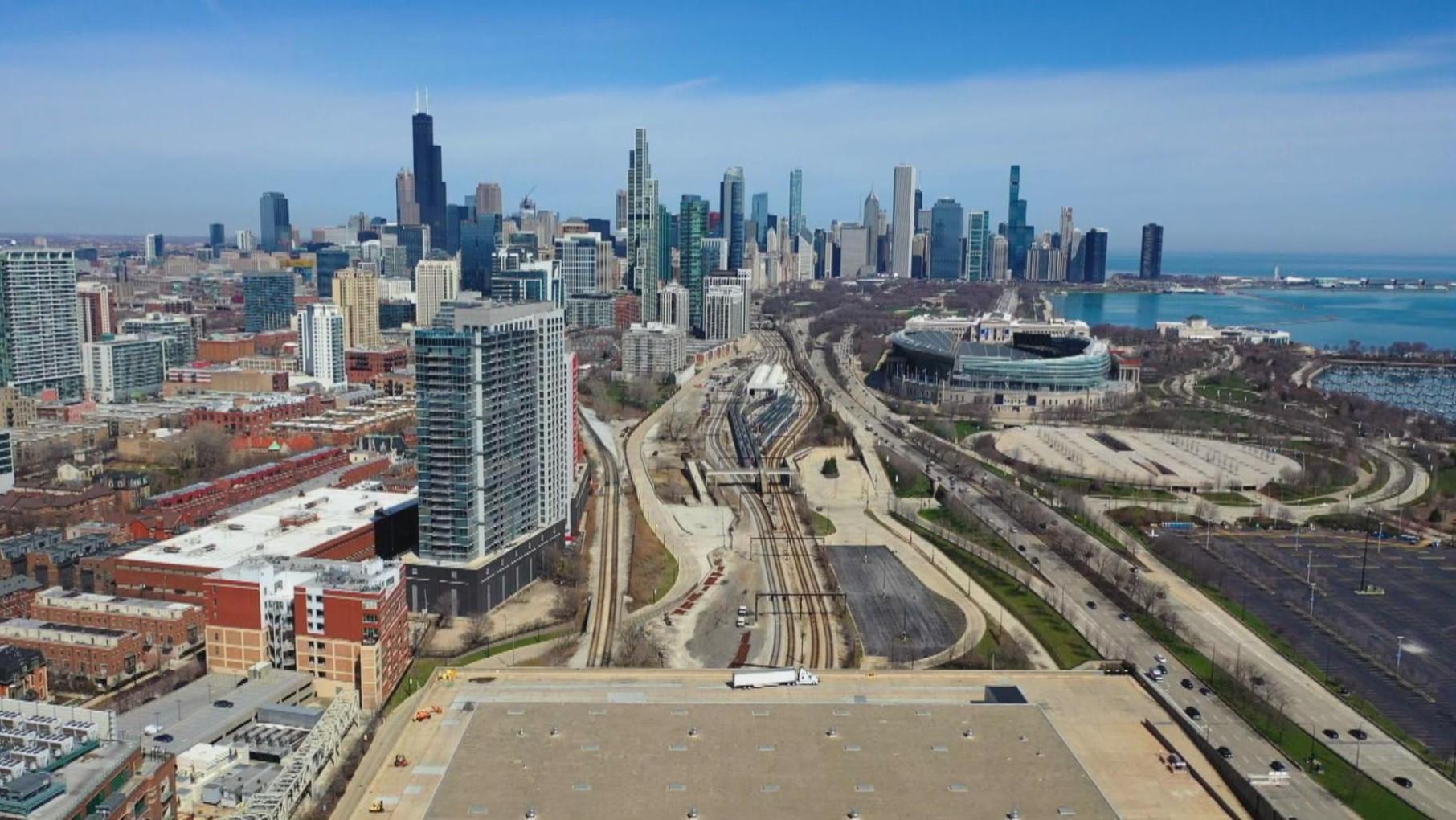 An aerial view of Chicago from the south looking north past Soldier Field at the skyline and lake