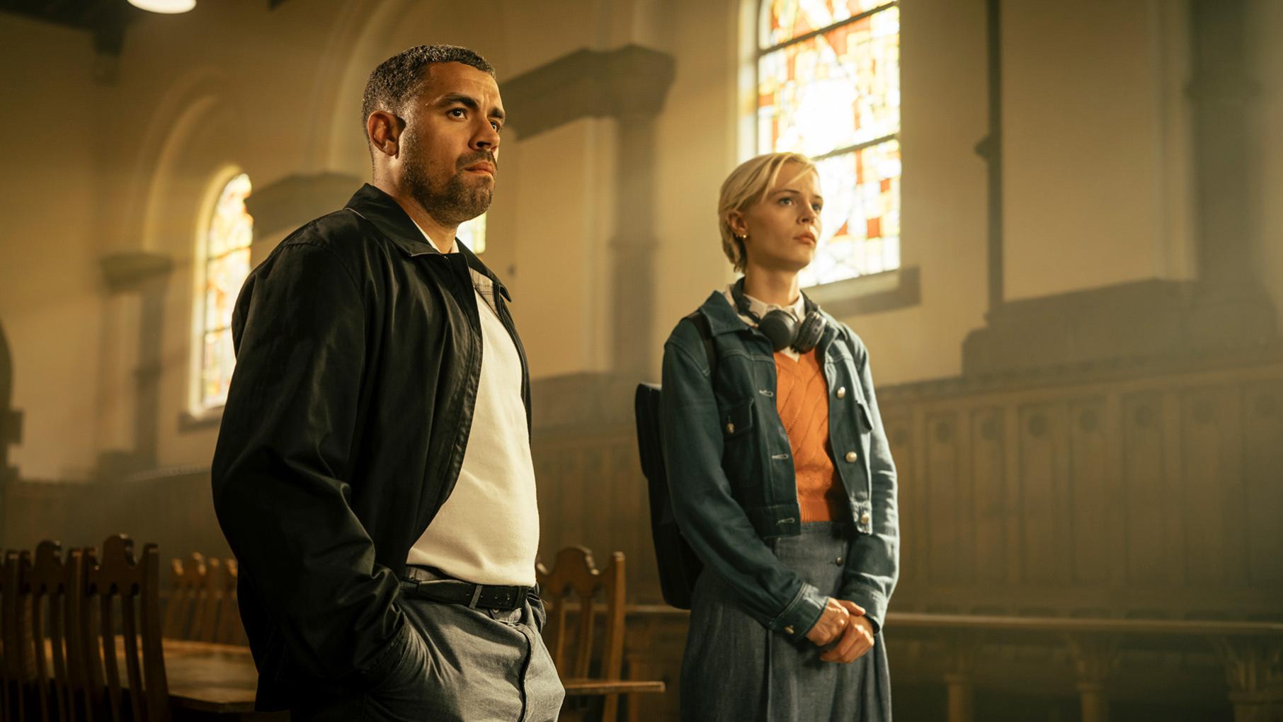 Jake and Patience stand in a chapel