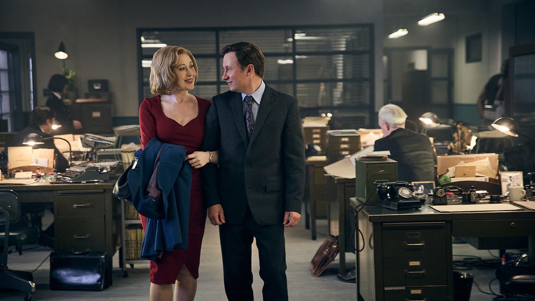 Miss Scott and Larry on each other's arms in the police station