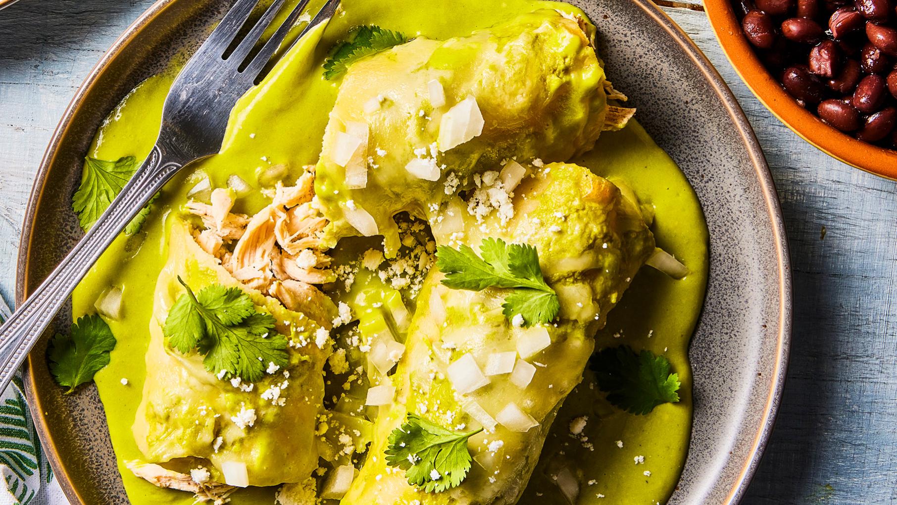 A plate of enchiladas swathed in sauce