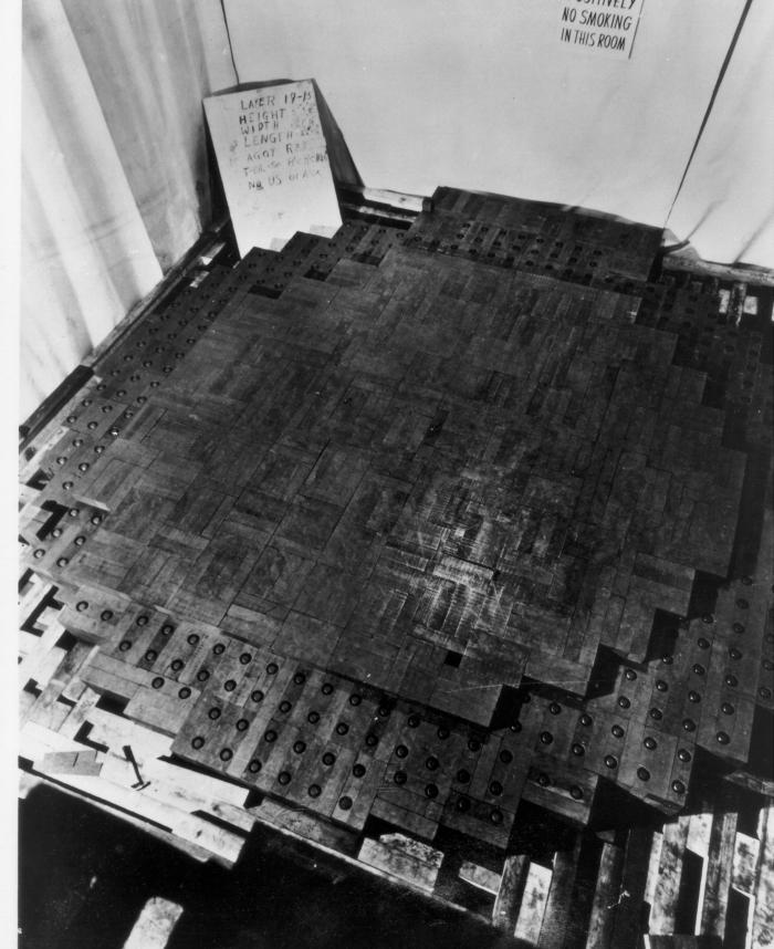 The only known photograph of the original Chicago Pile-1, midway through construction. Note the "No Smoking" sign on the back wall. (Photo courtesy of Argonne National Laboratory)