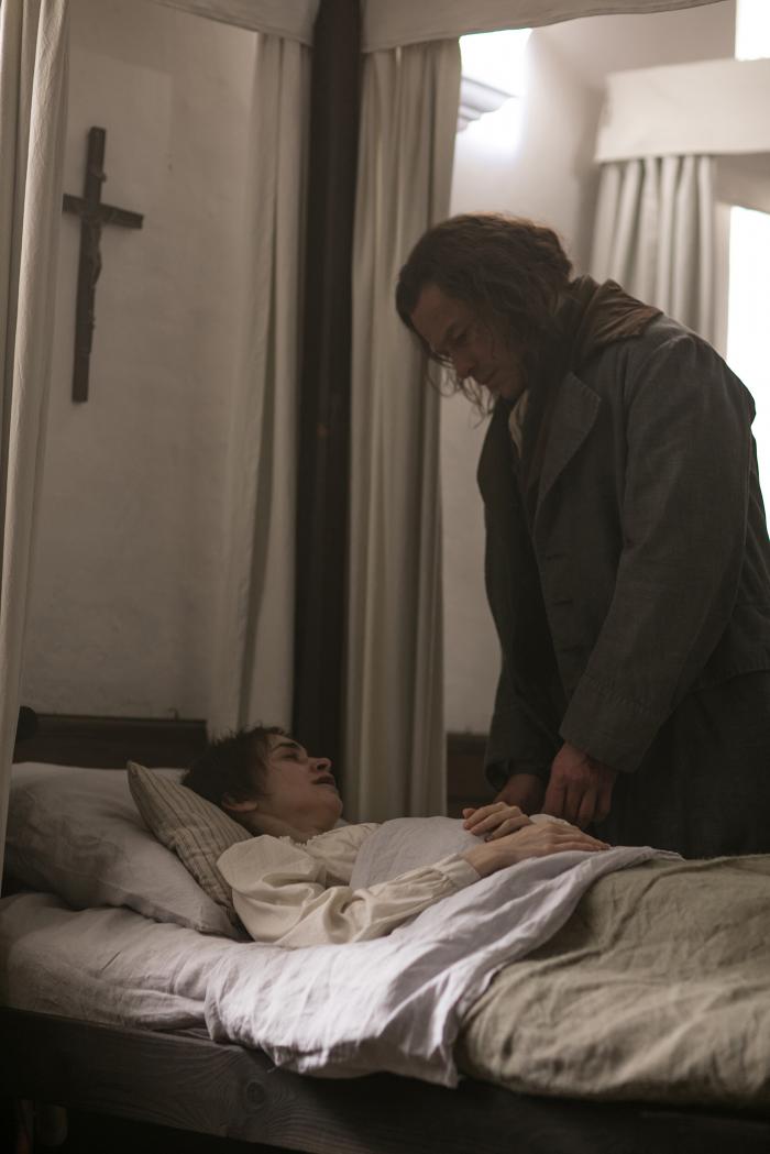 Jean Valjean (Dominic West) at the bedside of the dying Fantine (Lily Collins) in Les Miserables. Photo: Laurence Cendrowicz / Lookout Point