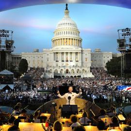 Jack Everly conducts the National Symphony Orchestra before an audience on the West Lawn of the U.S. Capitol. Credit: Capital Concerts