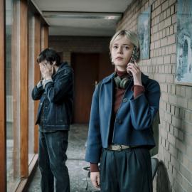 Patience stands on the phone while Billy stands behind her with his hands on his face