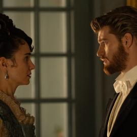 Frances faces Jo, both in evening wear