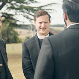 The bishop and the vicar John Planer speak to Alphy outside