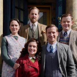 Mrs. Hall, Siegfried, Tristan, James, and Helen pose in front of Skeldale Hall
