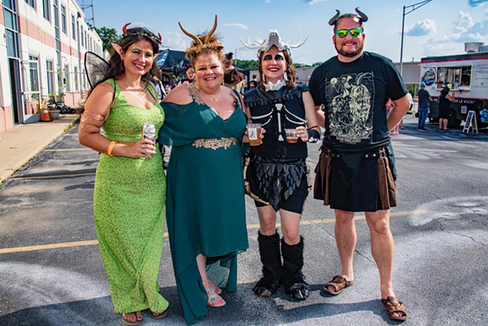 Four people dressed in fairy costumes