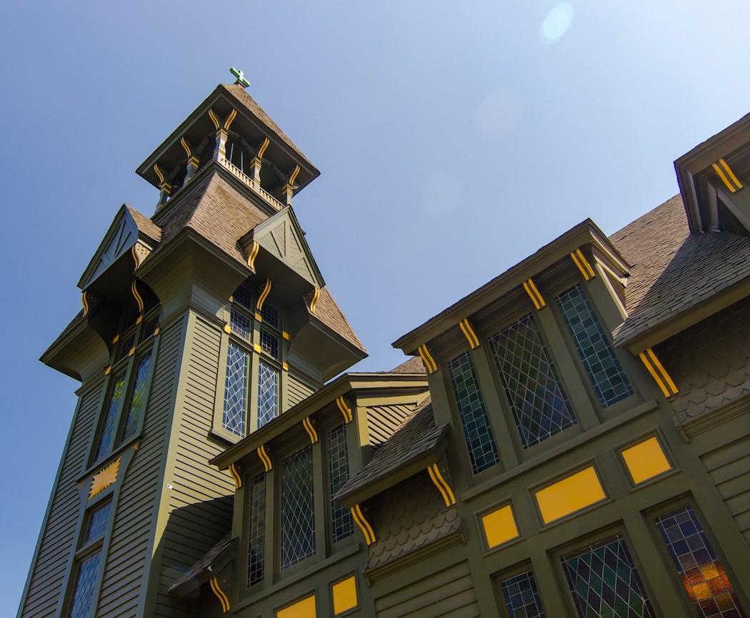 The bell tower of All Saints Episcopal Church in Chicago against a blue sky