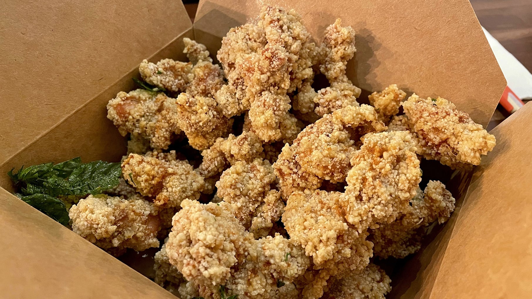 A box of fried popcorn chicken