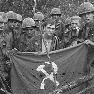 American soldiers display captured enemy flag. January 19, 1967. Photo: Bettmann/Getty Images
