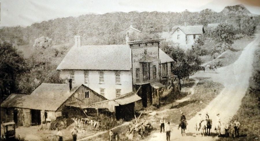 A black and white historical image of The Village Tavern